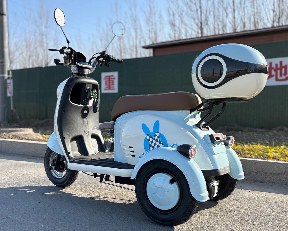 V1 Electric Tricycle | Light Blue Rabbit Rear View V1 light blue electric tricycle rear view, 3-wheel electric trike with rabbit design and child seat for family travel