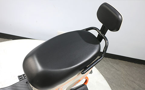 Electric Scooter | Comfortable Saddle with Backrest Detail Black padded ergonomic saddle with backrest for dual round headlight electric scooter, comfortable seat for long rides