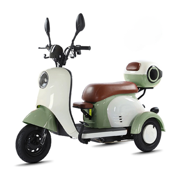 Green and white electric tricycle, side view
