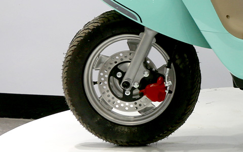 Front wheel hydraulic disc brake system of mint green electric scooter, safe and reliable braking