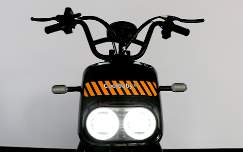 KM electric motorcycle front view with dual LED headlights and high-rise handlebars